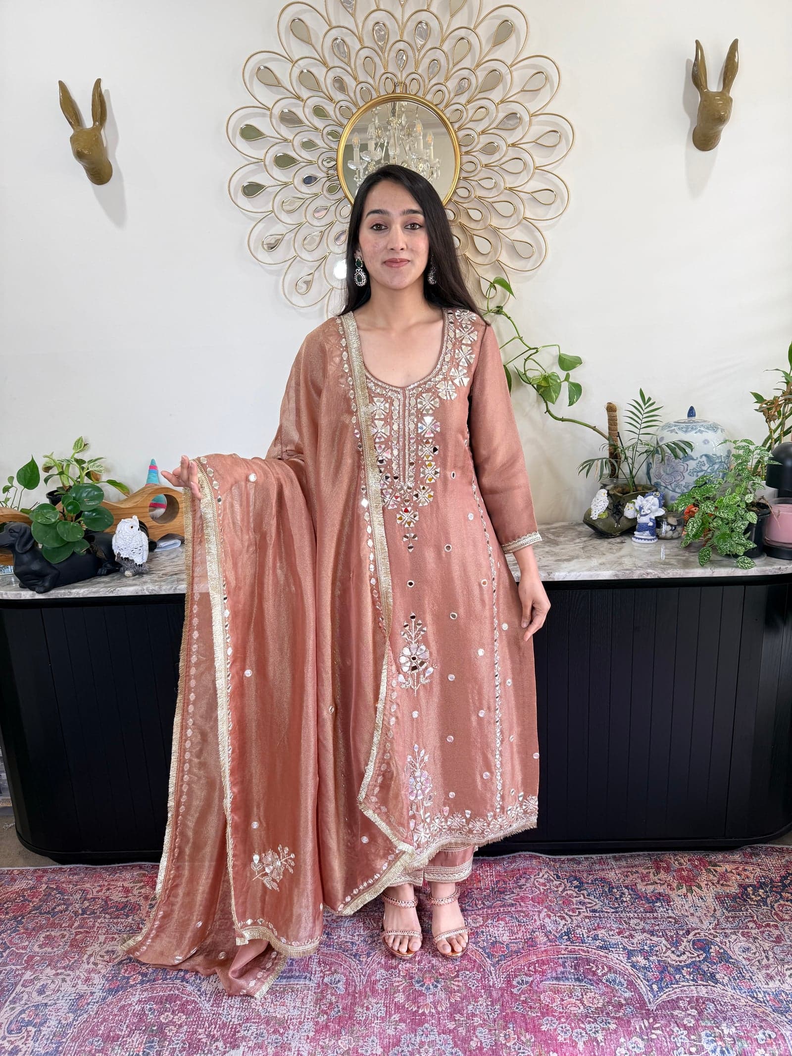Dusty pink suit with mirror work — editorial reference